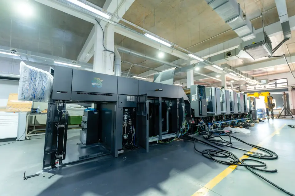 Heidelberg Speedmaster press line being installed in a workshop