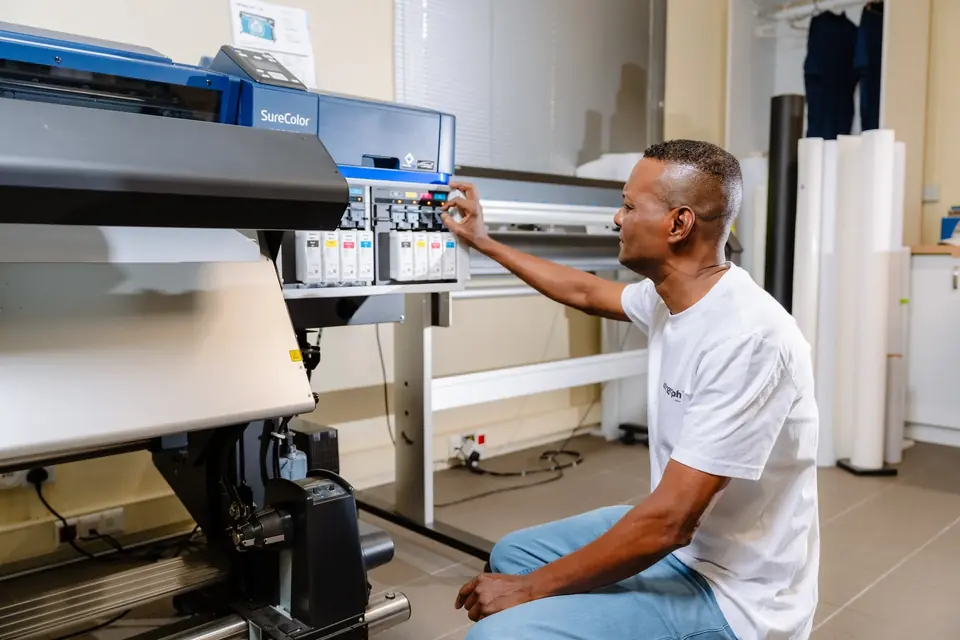 Technician at work on an Epson SureColor printer